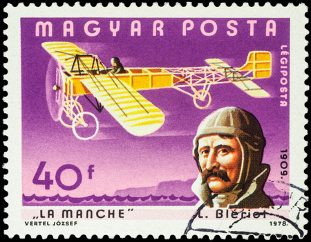 MOSCOW, RUSSIA - APRIL 12, 2016: A stamp printed in Hungary shows French aviator Louis Bleriot and his plane over the Strait of La Manche, series "Pilots and Aircrafts", circa 1978のeditorial素材