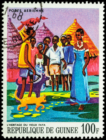 MOSCOW, RUSSIA - MAY 12, 2016: A stamp printed in Guinea shows image of African Legends - Heritage of the old Faya, series "Paintings of African Legends", circa 1968のeditorial素材