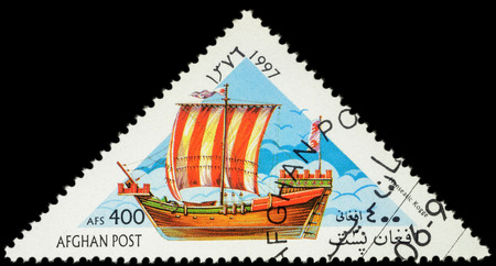 MOSCOW, RUSSIA - MAY 17, 2016: A stamp printed in Afghanistan shows image of ancient Hanseatic military and merchant ship Kogge, series "Sailing Ships", circa 1997のeditorial素材