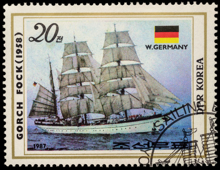 MOSCOW, RUSSIA - MAY 17, 2016: A stamp printed in DPRK (North Korea) shows image of "Gorch Fock II", a tall ship of the German Navy (1958) and flag of Germany, series "Sailing Ships", circa 1987のeditorial素材