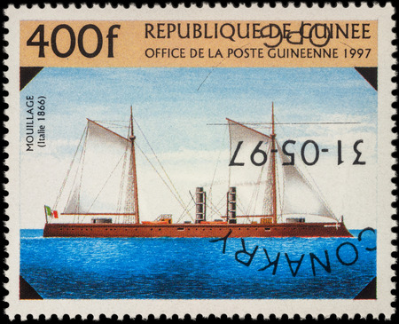 MOSCOW, RUSSIA - MAY 20, 2016: A stamp printed in Guinea shows old Italian warship "Mouillage" (1866), series "The 19th-Century Warships", circa 1997のeditorial素材