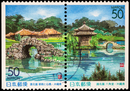 RUSSIA - JUNE 02, 2016: A stamp printed in Japan shows japanese garden with pond and bridges, series "Prefectural Stamps - Okinawa", circa 1999のeditorial素材