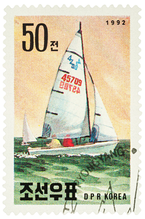 MOSCOW, RUSSIA - NOVEMBER 21, 2016: A stamp printed in DPRK (North Korea) shows yachting, series "International Stamp Exhibition Riccione '92 - Riccione, Italy - Sailboats", circa 1992のeditorial素材