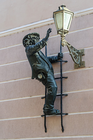 Uzhgorod, Ukraine - January 29, 2017: Sculpture of lamplighter "Uncle Kolya" on the wall in center of Uzhgorodのeditorial素材