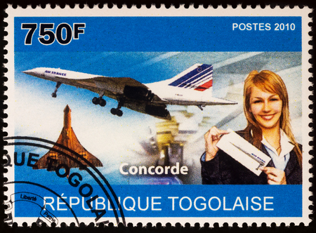 Moscow, Russia - July 04, 2017: A stamp printed in Togo shows supersonic airliner Concorde and stewardess, series "Transport - Airliners", circa 2010のeditorial素材