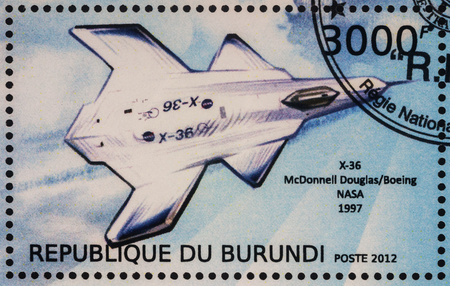 Moscow, Russia - July 17, 2017: A stamp printed in Burundi shows unmanned aerial vehicle McDonnell Douglas X-36, experimental tailless fighter aircraft (1997), series "Aircraft X", circa 2012の写真素材