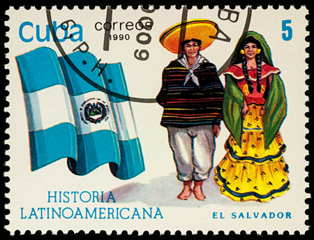 Moscow, Russia - August 10, 2017: A stamp printed in Cuba, shows national flag and a couple in traditional costumes of El Salvador, seriesのeditorial素材
