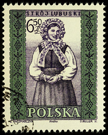 Moscow, Russia - August 12, 2017: A stamp printed in Poland, shows woman in Polish traditional costume, Lubuskie region, series "Folk costumes", circa 1960のeditorial素材