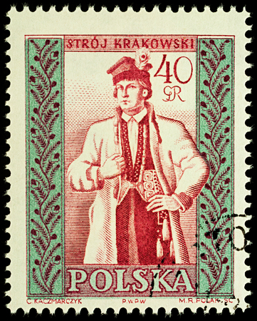 Moscow, Russia - August 12, 2017: A stamp printed in Poland, shows man in Polish traditional costume, Cracow region, series "Folk costumes", circa 1960のeditorial素材