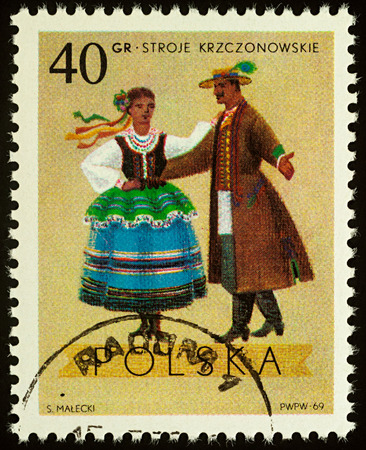 Moscow, Russia - August 11, 2017: A stamp printed in Poland, shows dancing couple in traditional costumes from Krczonow, Lublin, seriesのeditorial素材