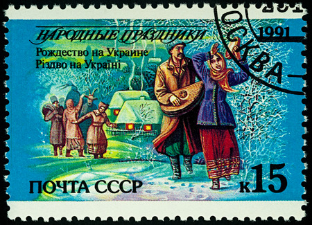 Moscow, Russia - August 14, 2017: A stamp printed in the USSR, shows Christmas in Ukraine, winter landscape, seriesのeditorial素材