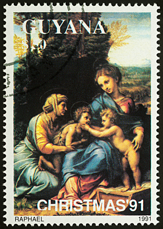Moscow, Russia - August 21, 2017: A stamp printed in Guyana, shows painting "The Holy Family" by Raphael (1483-1520), series "Christmas - Madonna Paintings", circa 1991のeditorial素材