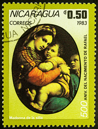 Moscow, Russia - August 21, 2017: A stamp printed in Nicaragua, shows painting "Madonna" by Raphael, series "The 500th Anniversary of the Birth of Raphael, 1483-1520", circa 1983のeditorial素材