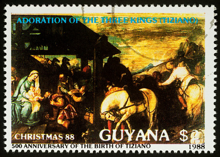 Moscow, Russia - August 24, 2017: A stamp printed in Guyana, shows painting "Adoration of the kings" by Titian, series "The 500th Anniversary of the Birth of Titian, 1488-1576", circa 1988のeditorial素材
