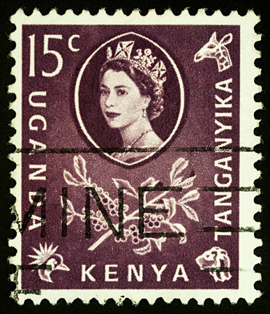 Moscow, Russia - September 06, 2017: A stamp printed in Uganda, Kenya, Tanganyika shows Queen of Great Britain Elizabeth II and branch with coffee berries, circa 1960のeditorial素材