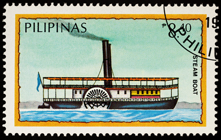 Moscow, Russia - November 21, 2017: A stamp printed in Philippines shows old steamboat with paddle wheel, series "Water Transport", circa 1984のeditorial素材