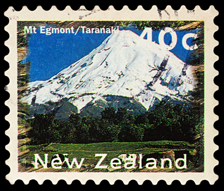 Moscow, Russia - November 25, 2017: A stamp printed in New Zealand, shows mountain Egmont - Taranaki landscape, series "New Zealand Scenery", circa 1996のeditorial素材
