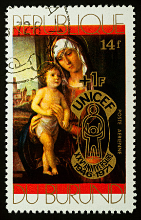 Moscow, Russia - December 08, 2017: A stamp printed in Burundi shows painting "Madonna and Child" by Italian painter Cima da Conegliano (1459-1517), series "Christmas", circa 1971のeditorial素材