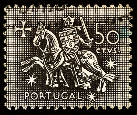 Moscow, Russia - December 27, 2017: A stamp printed in Portugal shows Knight on horseback (from the seal of King Diniz of Portugal, 1261-1325), circa 1953のeditorial素材