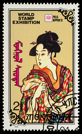 Moscow, Russia - January 09, 2018: A stamp printed in Mongolia shows painting of Japanese beautiful woman, series "International Stamp Exhibition "PHILANIPPON '91" - Tokyo, Japan", circa 1991のeditorial素材
