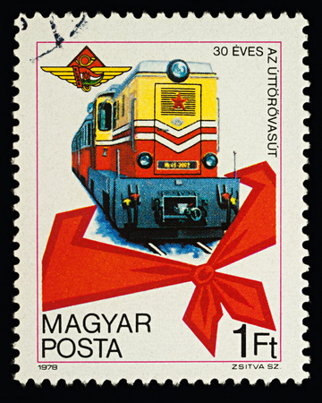 Moscow, Russia - February 16, 2018: A stamp printed in Hungary, shows little train and red pioneer tie, dedicated to the 30th anniversary of Pioneers' Railway, circa 1978のeditorial素材