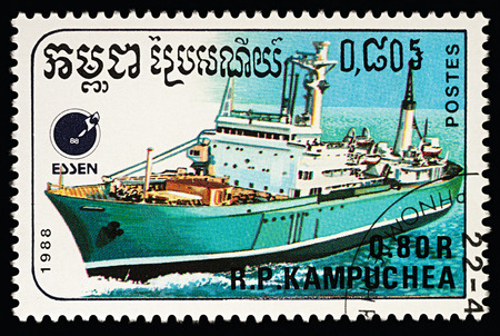 Moscow, Russia - March 13, 2018: A stamp printed in Cambodia shows cargo ship, series "Ships", circa 1988のeditorial素材