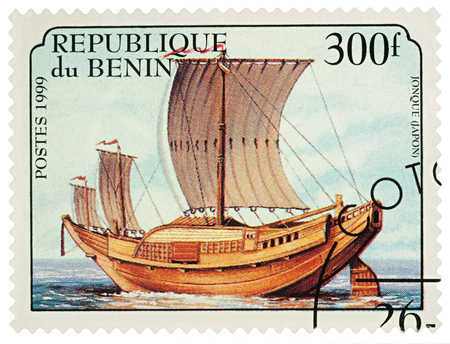 Moscow, Russia - March 20, 2018: A stamp printed in Benin shows Traditional sailing boat, Japanese junk, series "Sailing Boats", circa 1999のeditorial素材
