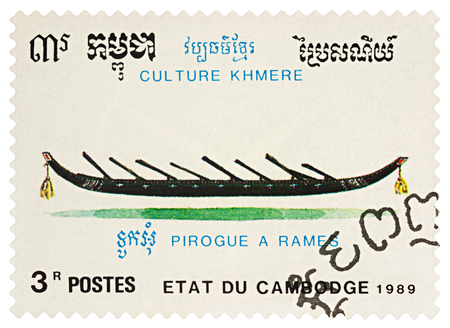 Moscow, Russia - March 23, 2018: A stamp printed in Cambodia shows old traditional boat - pirogue, series "Khmer Culture", circa 1989のeditorial素材
