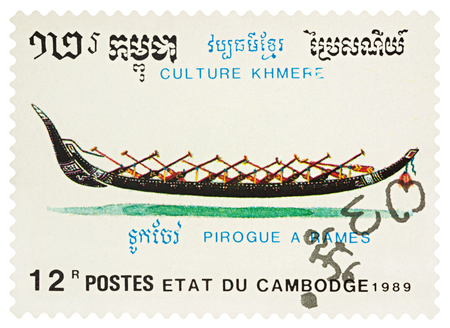 Moscow, Russia - March 23, 2018: A stamp printed in Cambodia shows old traditional rowing boat - pirogue, series "Khmer Culture", circa 1989のeditorial素材