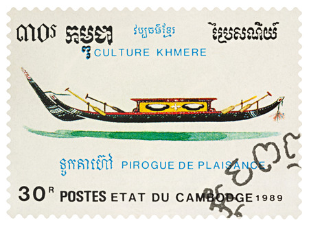 Moscow, Russia - March 24, 2018: A stamp printed in Cambodia shows traditional rowing boat pirogue, series "Khmer Culture", circa 1989のeditorial素材