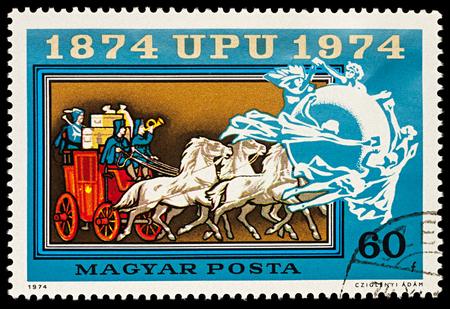 Moscow, Russia - April 05, 2018: A stamp printed in Hungary shows historical horse-drawn mail coach, series "100th Anniversary of the Universal Postal Union", circa 1974のeditorial素材
