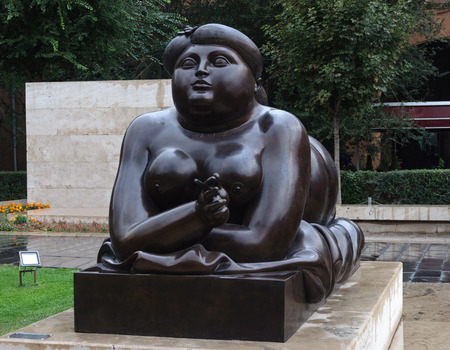 Yerevan, Armenia - October 04, 2017: Black sculpture of lying smoking woman by Fernando Botero. Gallery of contemporary art at Cascade complex in Yerevan, rainy weatherのeditorial素材