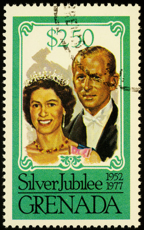 Moscow, Russia - October 17, 2019: stamp printed in Grenada shows Queen Elizabeth II and Prince Philip Duke of Edinburgh, series "The 25th Anniversary of the Reign of Queen Elizabeth II", circa 1977のeditorial素材
