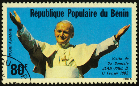 Moscow, Russia - November 27, 2019: Stamp printed in Benin, shows portrait of Pope John Paul II (1920-2005), visit in Africa, circa 1982のeditorial素材