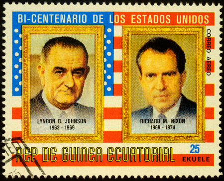 Moscow, Russia - October 28, 2019: stamp printed in Equatorial Guinea shows portraits of american Presidents Lyndon B. Johnson (1908-1973) and Richard M. Nixon (1913-1994), circa 1975のeditorial素材