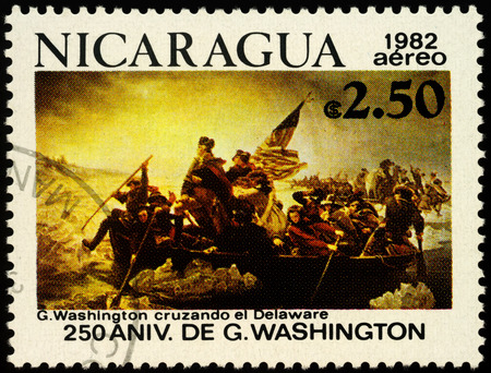 Moscow, Russia - October 30, 2019: stamp printed in Nicaragua shows picture George Washington Crossing the Delaware at Trenton on December 25, 1776 by Emanuel Leutze (1851), circa 1982のeditorial素材
