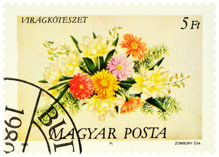 Moscow, Russia - December 18, 2019: stamp printed in Hungary shows decorative bouquet of lilies and dahlias, series "Flower Arrangements", circa 1989のeditorial素材