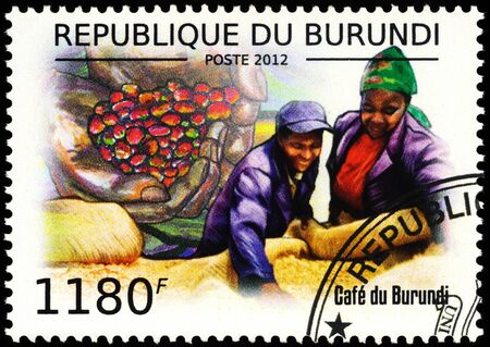 Moscow, Russia - February 04, 2020: stamp printed in Burundi shows coffee harvest, coffee beans in the palms, series "Coffee of Burundi", circa 2012のeditorial素材