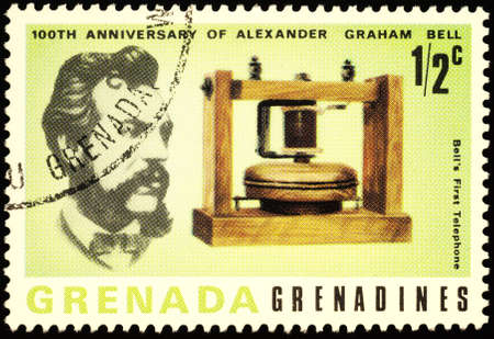 Moscow, Russia - March 01, 2020: stamp printed in Grenada, shows Alexander Graham Bell (1847-1922), American inventor, scientist, engineer, and his first telephone, circa 1977のeditorial素材