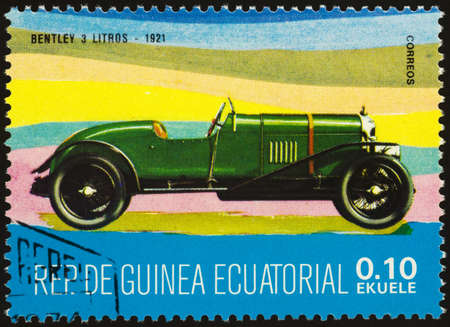 Moscow, Russia - September 07, 2020: stamp printed in Equatorial Guinea shows retro car Bentley 3 Litros (1921), circa 1977のeditorial素材