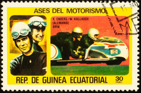 Moscow, Russia - September 14, 2020: stamp printed in Equatorial Guinea shows German road sidecar racers Klaus Enders and Wolfgang Kallaugh, series Motorcyclists, circa 1976のeditorial素材
