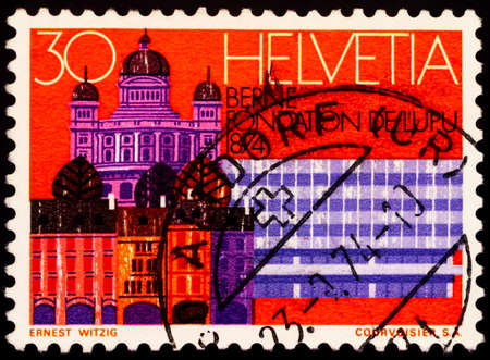 Moscow, Russia - February 19, 2021: stamp printed in Switzerland shows Bern, seat of the UPU, series Universal Postal Union Congress, Lausanne, circa 1974のeditorial素材
