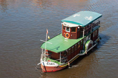 Prague, Czech Republic - July 23, 2019: Old pleasure boat with tourists on Vltava River. View from above.のeditorial素材