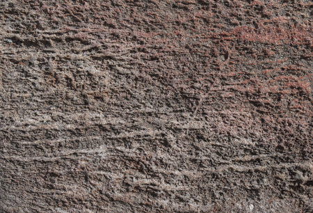 Closeup of weathered uneven gray stone texture