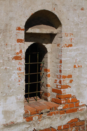 Window of the ancient and uncared church in Central Russiaの写真素材