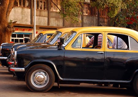 Anbassador cabs awaiting passengers at the cab-stand in India.の写真素材