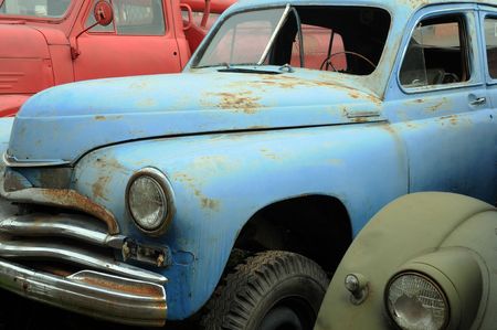 Rusty vintage cars in the graveyard in Russiaの写真素材