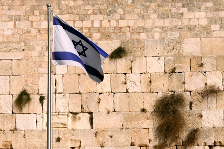 State flag of Israel against the background of the Wailing wall in Jerusalem, Israel.の写真素材