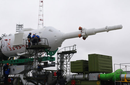 BAIKONUR, KAZAKHSTAN - APRIL 2, 2011: Technicians and specialists provide service to Russian Soyuz TMA-21 spacecraft right upon its arrival at the launch pad at Baikonur cosmodromeのeditorial素材