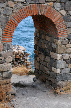 Arch of the ruined fortress tower in the town of Sozopol in Bulgariaの写真素材